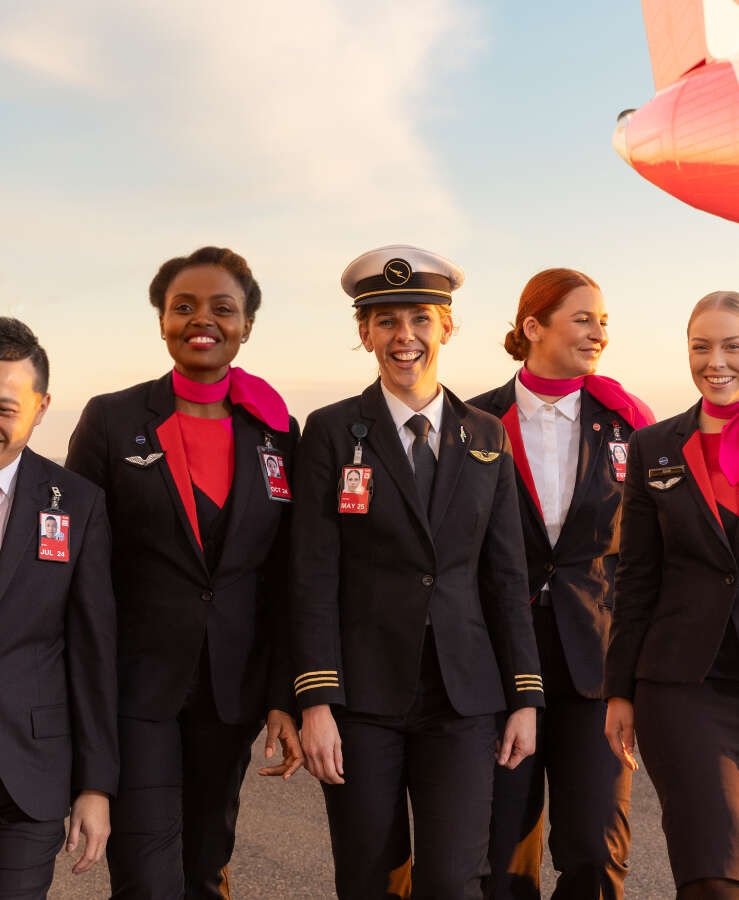 Qantas pilot and crew walking on tarmac