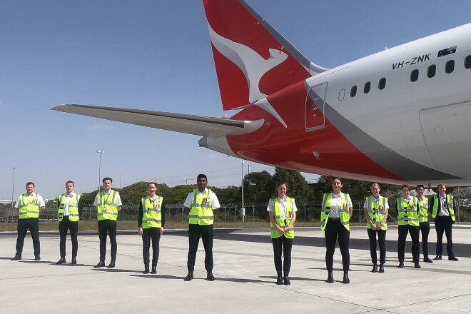 Qantas Pilot Academy students in front of plane