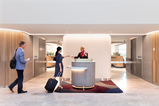 Qantas Domestic Lounge Brisbane , couple checking into the lounge