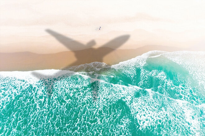 Aircraft shadow over beach