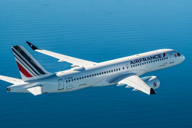 Air France aircraft in flight over water