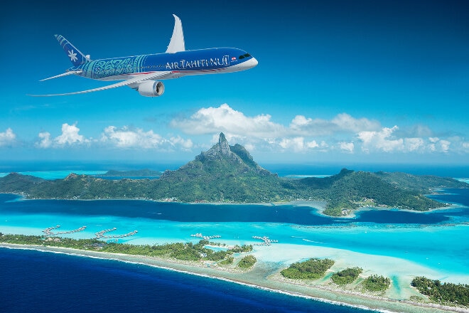 Air Tahiti Nui aircraft flying over Tahiti