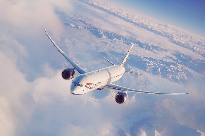 British Airways aircraft flying above the clouds