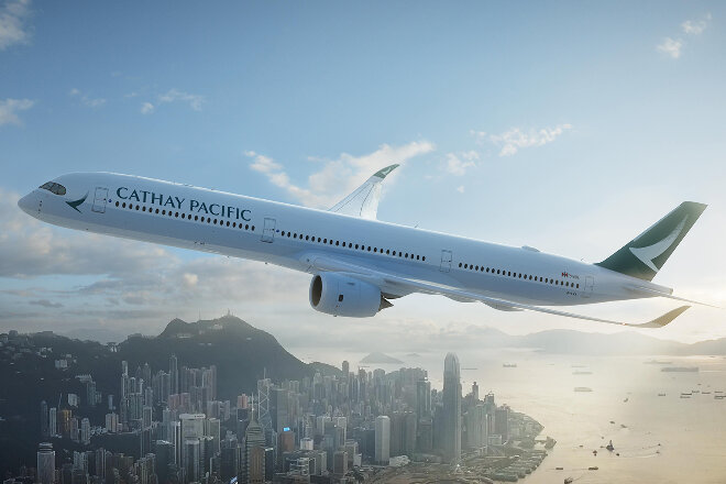 Cathay Pacific aircraft flying above Hong Kong