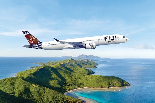 Fiji Airways aircraft in flight over Fijian islands