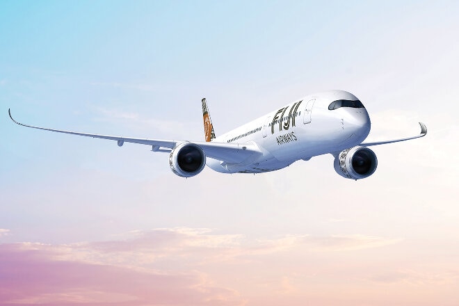 Fiji Airways aircraft in flight at sunrise