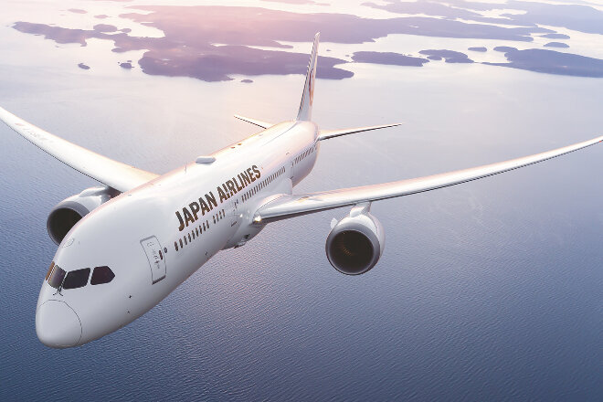 Japan Airlines aircraft flying over water