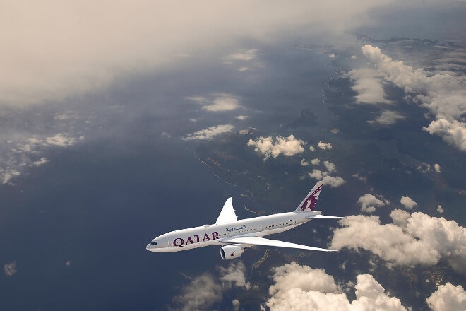 Qatar aircraft flying among clouds