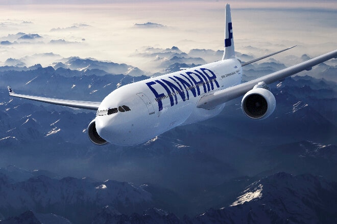 Finnair aircraft flying over mountains