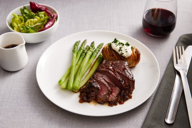 Beef fillet with onion and soy glaze, asparagus and Hasselback potatoes