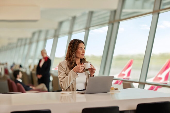 Sydney Qantas Club, lady drinking a coffee