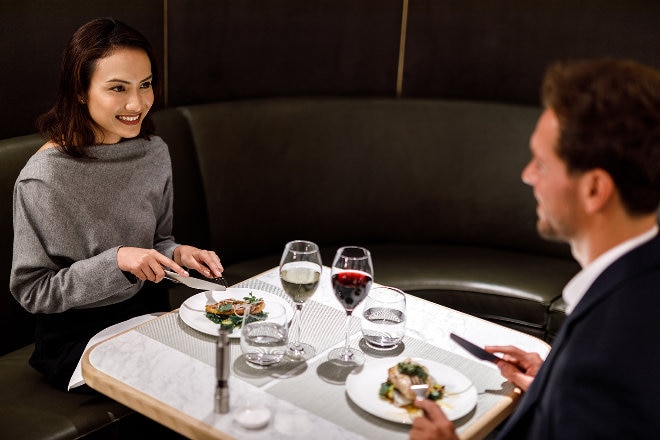 Singapore International First lounge couple dining 