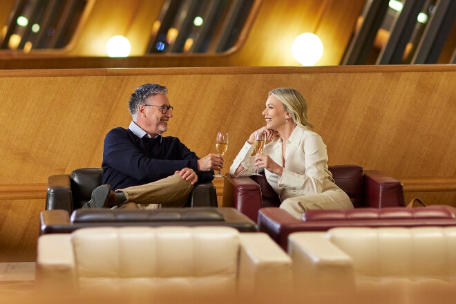 couple relaxing in first lounge