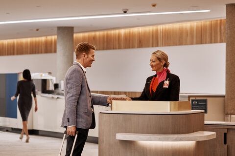 man checking in at a kiosk