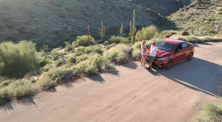 Couple enjoying desert view from roadside