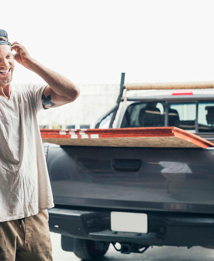 Carpenter loading a Ute