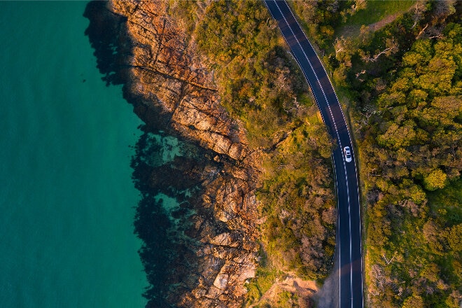 Aerial view of car along Mount Martha coastal drive