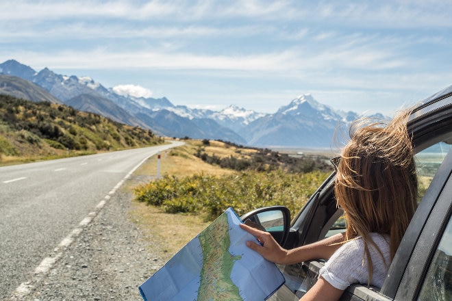 Driving with map through countryside