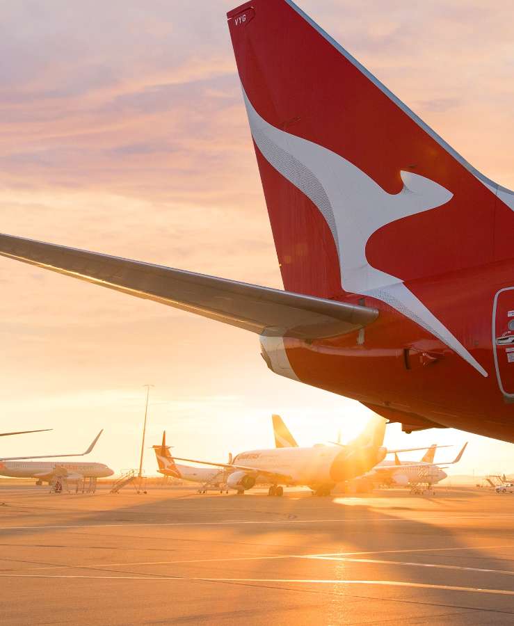 Aircraft tail on tarmac at dusk