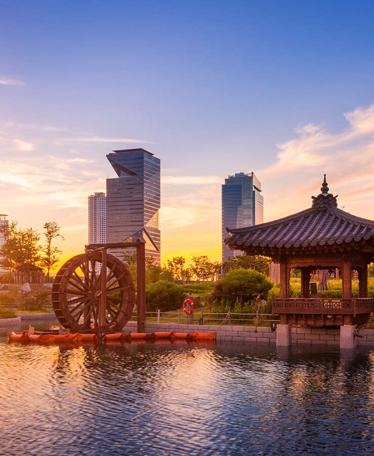 Seoul city with Beautiful sunset, traditional and modern architecture at central park