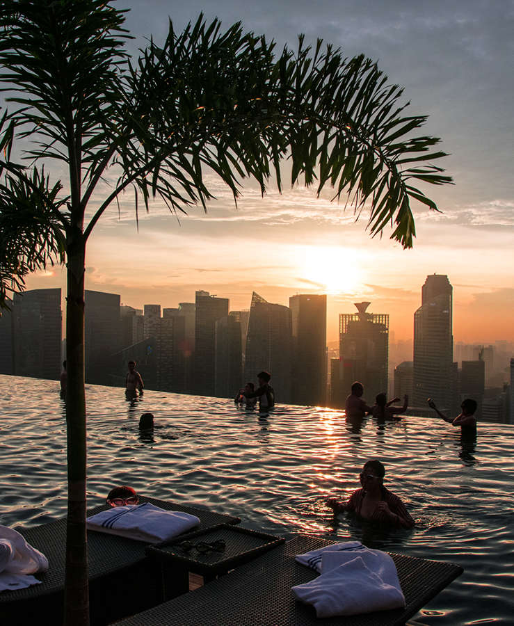 Marina Bay Sands rooftop pool at sunset