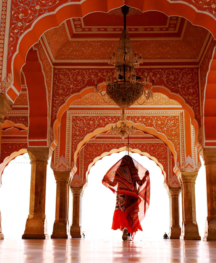 Women walking through indian palace 