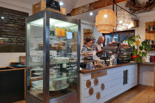 Staff serving coffee in a cafe