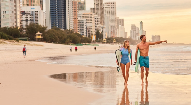 Couple walking along the beach at Surfers Paradise