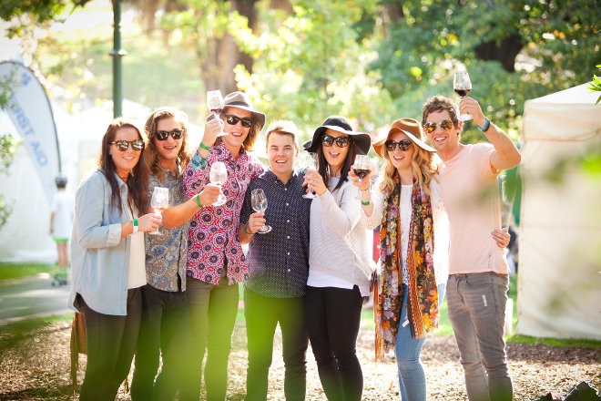 Happy friends drinking wine