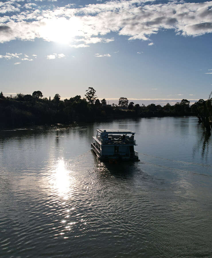 Houseboat on Murray River on a sunny day