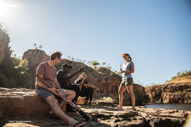 Tourists learning about Aboriginal culture