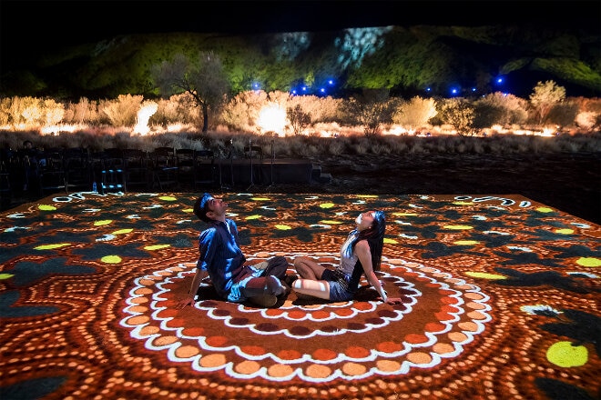 Couple watching lightshow at night