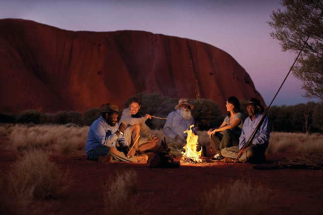 People around campfire at Uluru