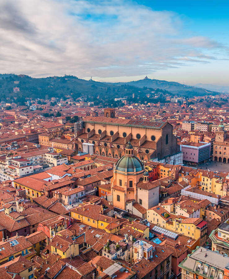 Bologna, Italy High Angle View Of Townscape Against Cloudy Sky