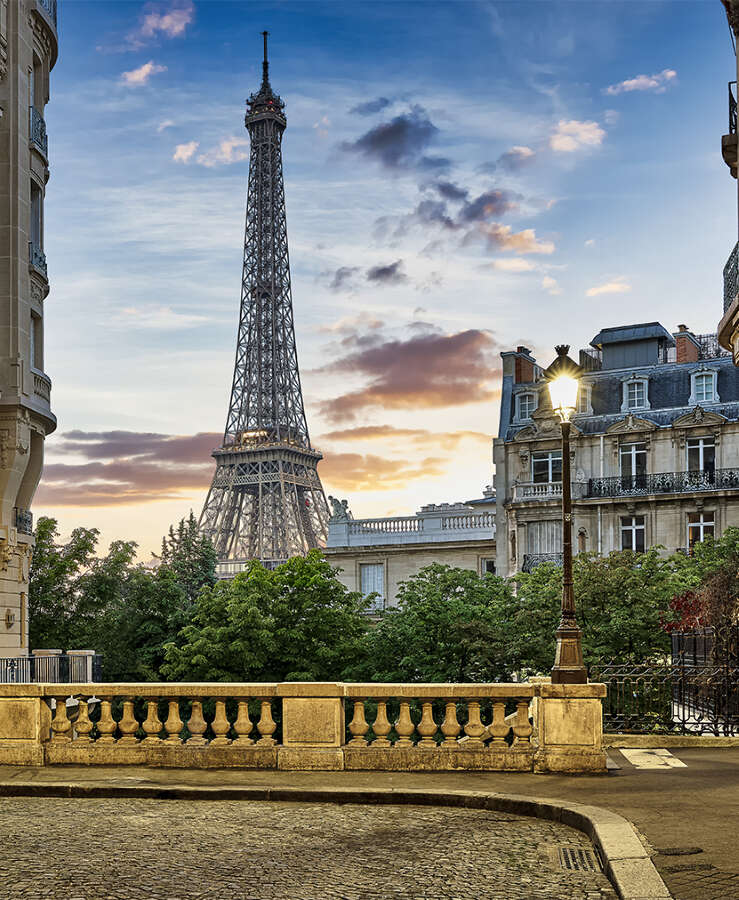 Eiffel Tower with Haussmann apartment Buildings in foreground, Paris, France