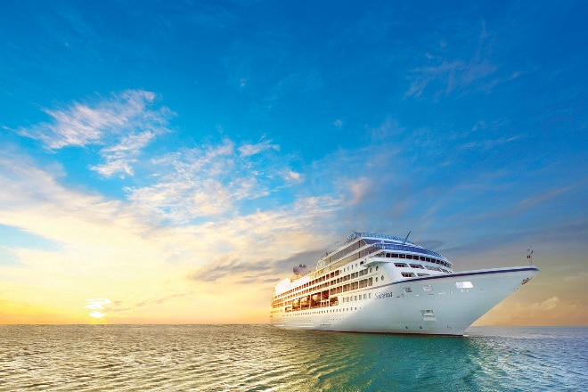 Cruise ship on the water at sunrise