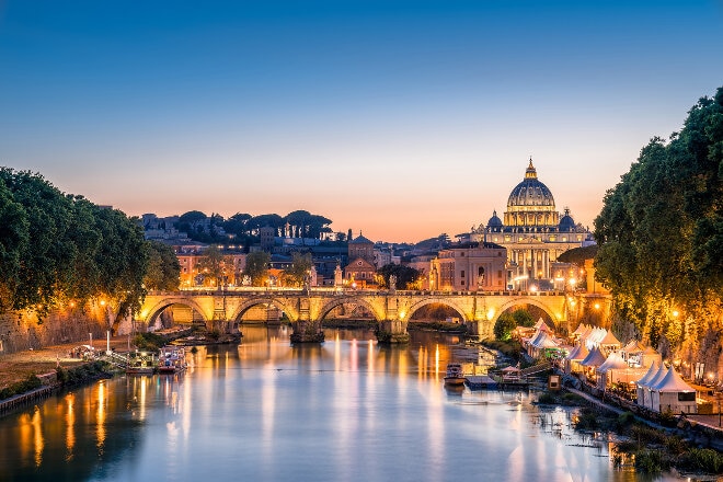 St. Peters Basilica in the Vatican and the Ponte Sant'Angelo, Bridge of Angels, at the Castel Sant'Angelo, Rome, Italy  