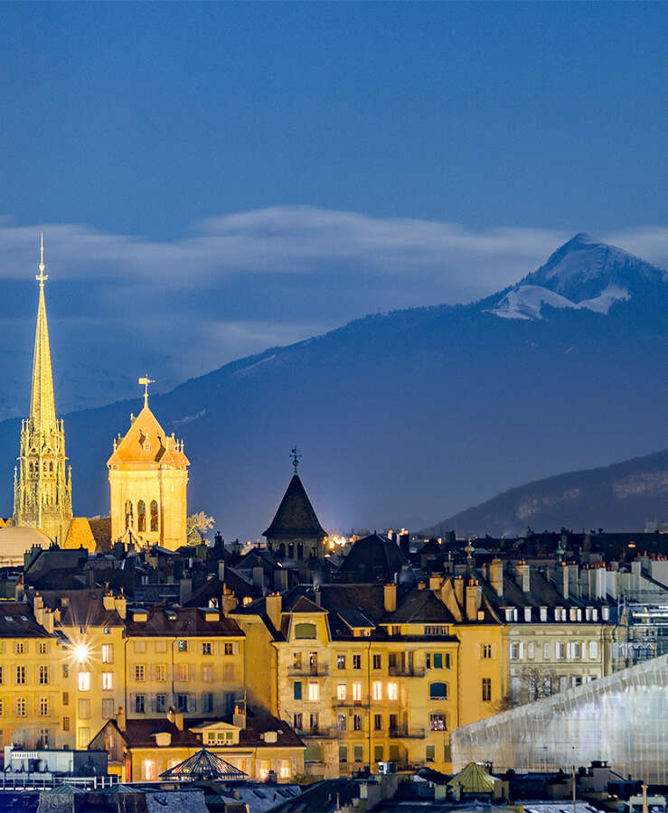 Illuminated St Pierre Cathedral In Town At Dusk