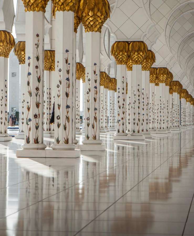 White marble mosque pillars with gold