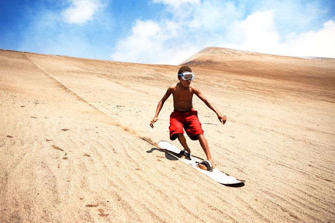 boy sandboarding in Vanuatu