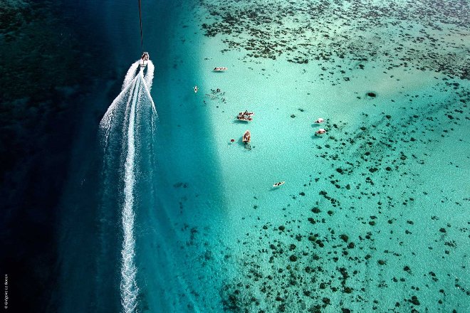 Boat cruising through water in Tahiti