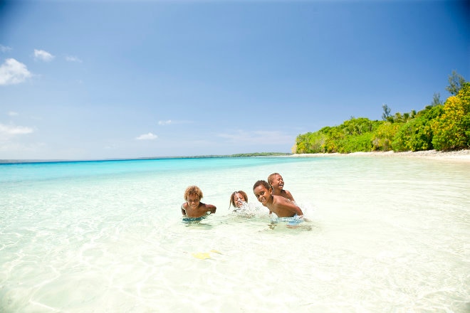 Children playing in the ocean