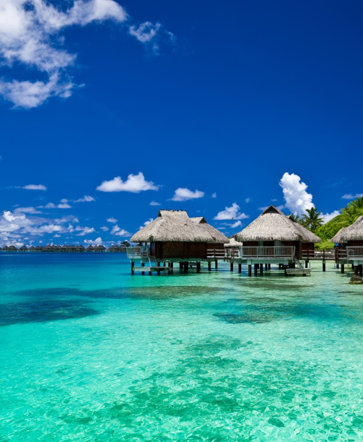 Over water bungalow over turquoise water in Tahiti South Pacific 