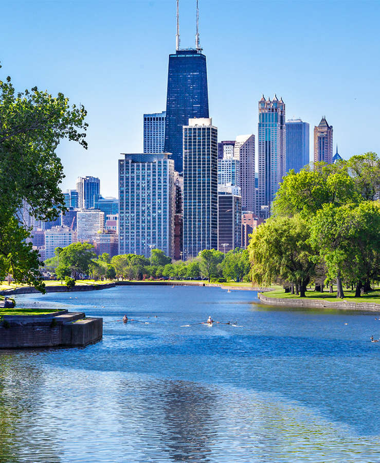 Chicago River with trees and view to the city