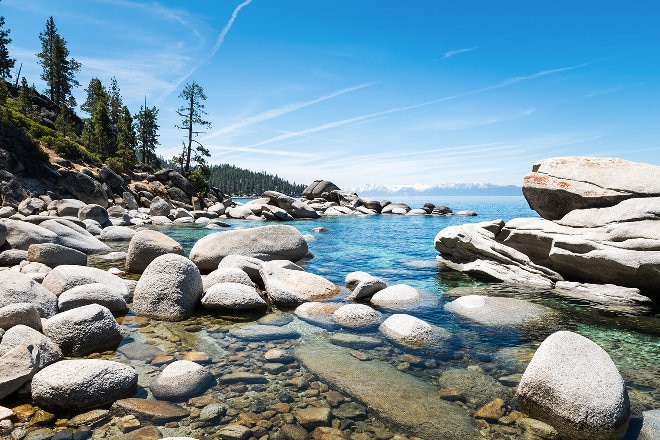 Blue water on lake against rocks