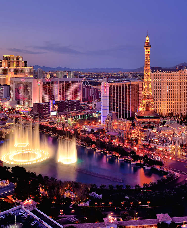 City skyline at night with Bellagio Hotel water fountains, Las Vegas, Nevada, America, USA