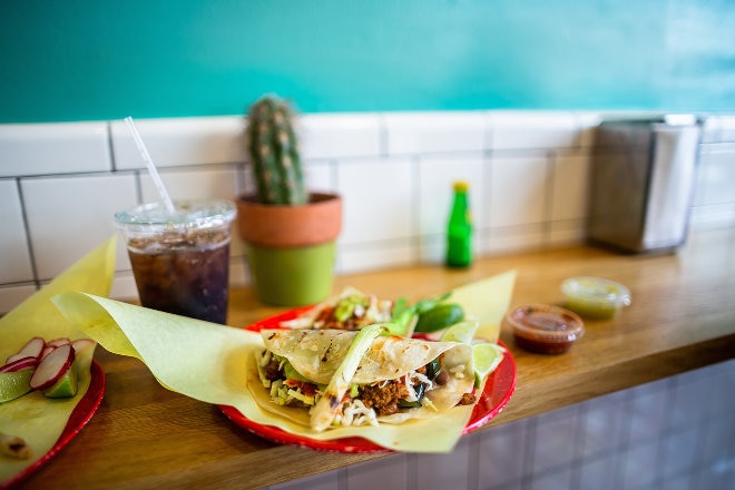 Plate of tacos and a soda