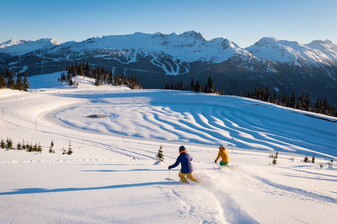 skiers coming down a mountain