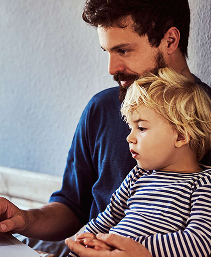 Father and his son using a laptop