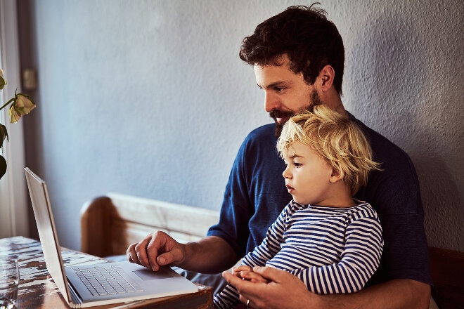 Father and his son using a laptop